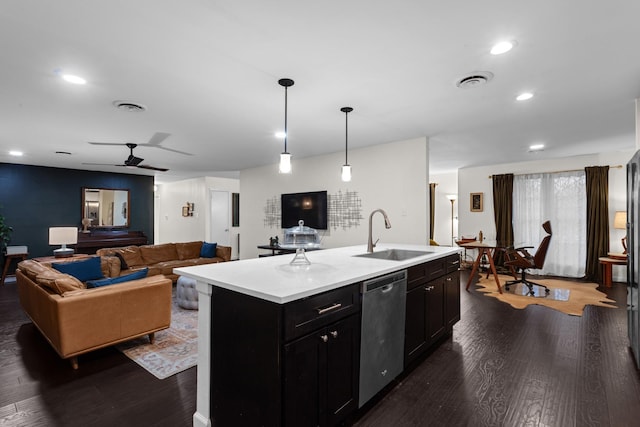 2512 Buckingham Dr, Denton, TX 76209 - kitchen featuring a sink, stainless steel dishwasher, dark wood-style flooring, light countertops, and dark cabinetry