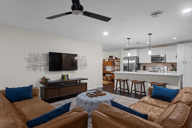 2512 Buckingham Dr, Denton, TX 76209 - living room with ceiling fan, recessed lighting, baseboards, and wood finished floors