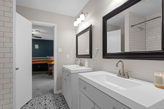 2512 Buckingham Dr, Denton, TX 76209 - full bathroom with two vanities, connected bathroom, tile patterned flooring, and a ceiling fan
