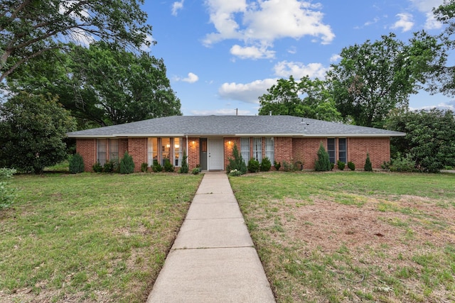 2512 Buckingham Dr, Denton, TX 76209 - ranch-style house with brick siding and a front yard