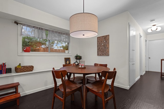 2512 Buckingham Dr, Denton, TX 76209 - dining room featuring baseboards and dark wood-style flooring