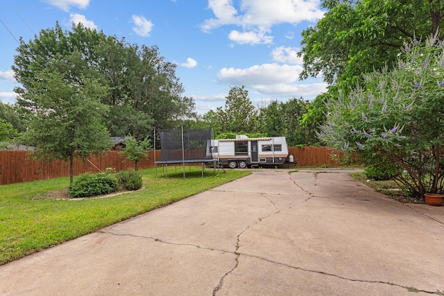 2512 Buckingham Dr, Denton, TX 76209 - view of front facade with a trampoline and driveway