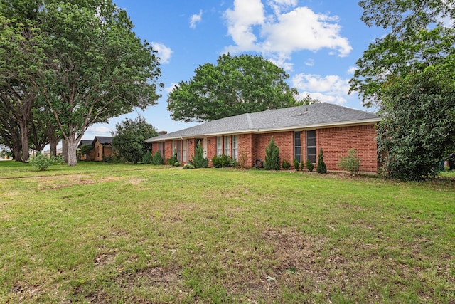 2512 Buckingham Dr, Denton, TX 76209 - back of property with a yard and brick siding
