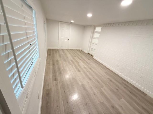 2711 San Diego Dr, Dallas, TX 75228 - basement with baseboards, wood finished floors, and recessed lighting