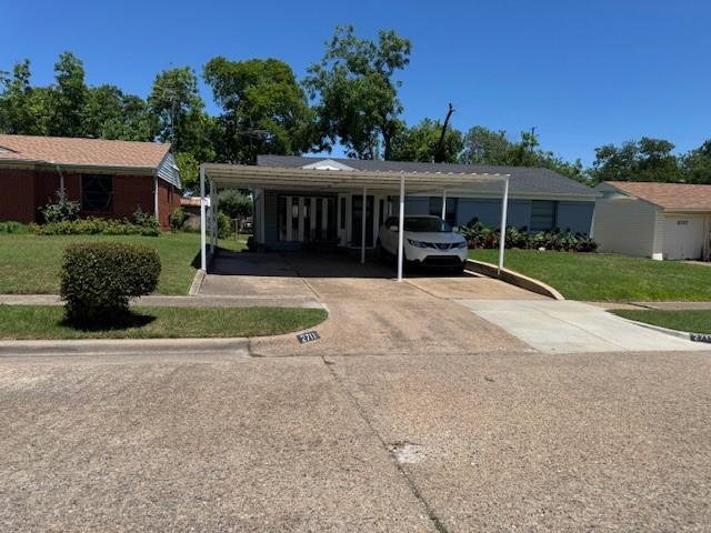 2711 San Diego Dr, Dallas, TX 75228 - view of parking featuring concrete driveway and a carport