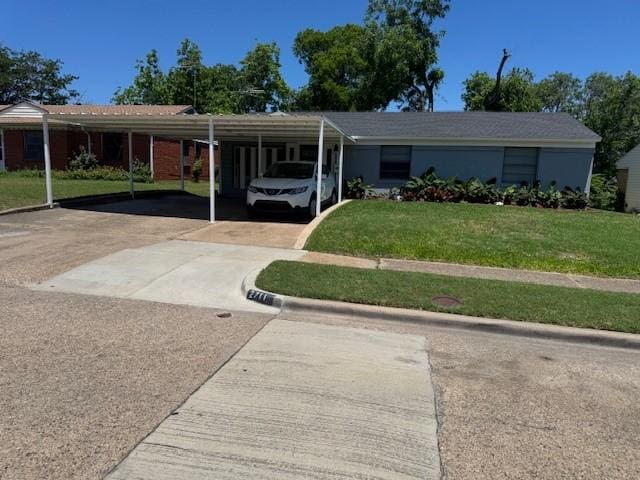 2711 San Diego Dr, Dallas, TX 75228 - ranch-style house featuring a front yard, a carport, and driveway