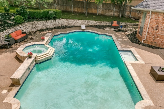 2313 Ember Woods Dr, Keller, TX 76262 - view of swimming pool featuring a pool with connected hot tub, a patio, and a fenced backyard