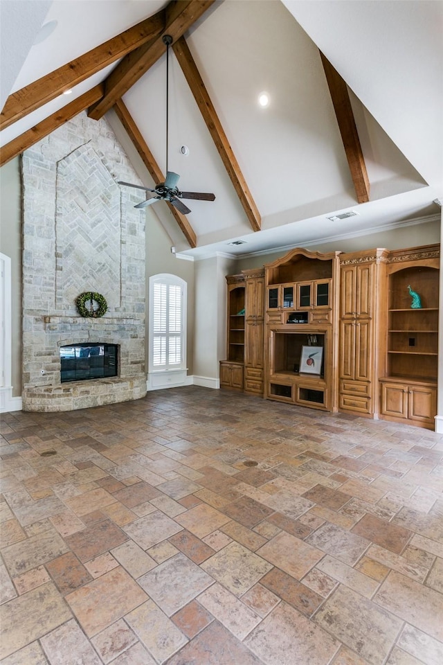 2313 Ember Woods Dr, Keller, TX 76262 - unfurnished living room with high vaulted ceiling, beam ceiling, ceiling fan, a stone fireplace, and baseboards