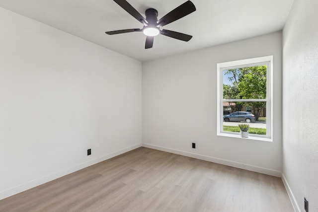 2023 William Ln, Carrollton, TX 75006 - unfurnished room with light wood finished floors, baseboards, and ceiling fan