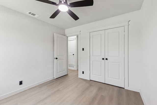 2023 William Ln, Carrollton, TX 75006 - unfurnished bedroom featuring light wood-type flooring, baseboards, a closet, and ceiling fan