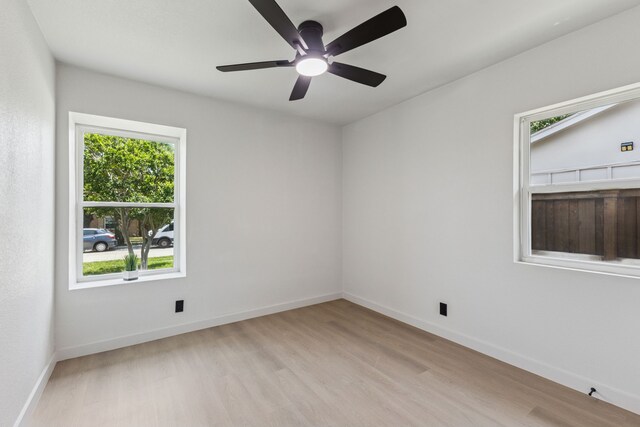 2023 William Ln, Carrollton, TX 75006 - unfurnished room with light wood-style flooring, baseboards, and a ceiling fan