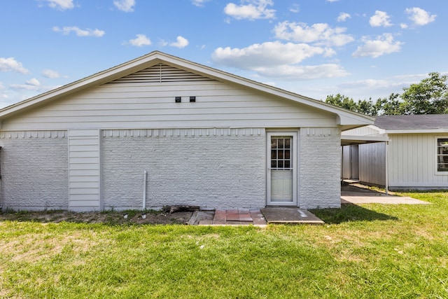 2023 William Ln, Carrollton, TX 75006 - back of property featuring a yard and brick siding