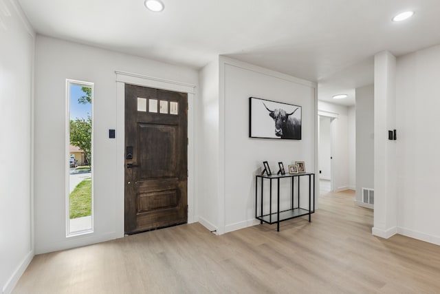 2023 William Ln, Carrollton, TX 75006 - foyer entrance with light wood-style flooring, baseboards, and recessed lighting