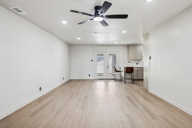 2023 William Ln, Carrollton, TX 75006 - unfurnished living room featuring french doors, light wood-style flooring, recessed lighting, ceiling fan, and baseboards