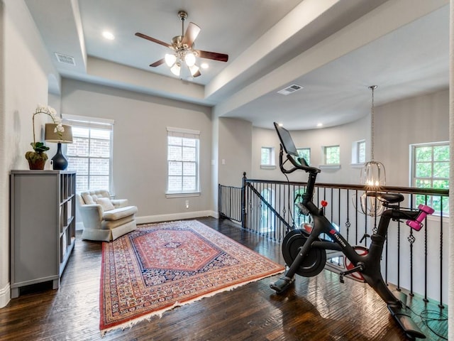 916 Shadyside Ln, Dallas, TX 75223 - workout room featuring healthy amount of natural light, dark wood-type flooring, ceiling fan, and baseboards