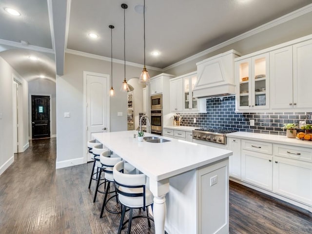 916 Shadyside Ln, Dallas, TX 75223 - kitchen with a sink, appliances with stainless steel finishes, a kitchen island with sink, backsplash, and dark wood-style flooring