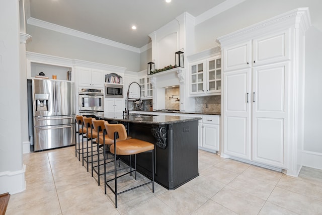 13 Kensington Dr, Heath, TX 75032 - kitchen with appliances with stainless steel finishes, a sink, light tile patterned floors, a breakfast bar, and white cabinets