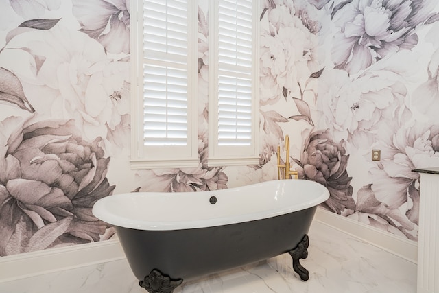 13 Kensington Dr, Heath, TX 75032 - full bath featuring marble look tiles and a freestanding tub