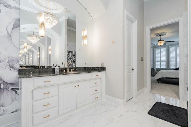 13 Kensington Dr, Heath, TX 75032 - ensuite bathroom with a chandelier, vanity, baseboards, marble finish flooring, and crown molding