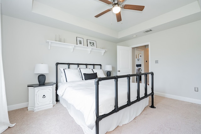 13 Kensington Dr, Heath, TX 75032 - bedroom with light carpet, baseboards, a raised ceiling, and ceiling fan