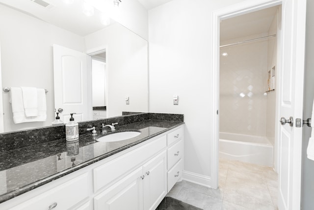 13 Kensington Dr, Heath, TX 75032 - full bath with vanity, tub / shower combination, baseboards, and tile patterned floors