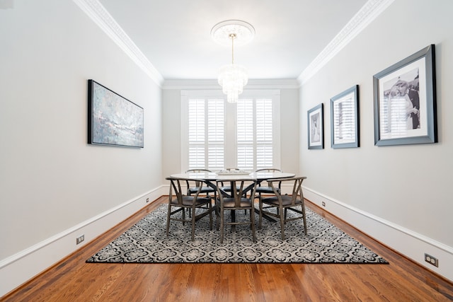 13 Kensington Dr, Heath, TX 75032 - dining area with wood finished floors, ornamental molding, a chandelier, and baseboards
