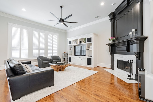 13 Kensington Dr, Heath, TX 75032 - living area featuring a ceiling fan, a fireplace with flush hearth, light wood-style flooring, crown molding, and recessed lighting
