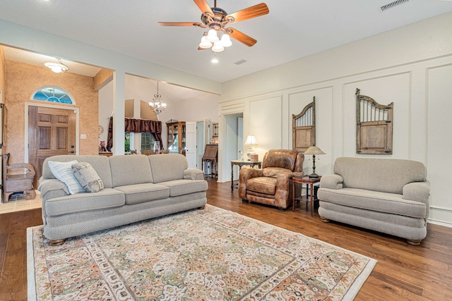 10253 Fieldcrest Dr, Benbrook, TX 76126 - living room featuring ceiling fan, a chandelier, and wood finished floors