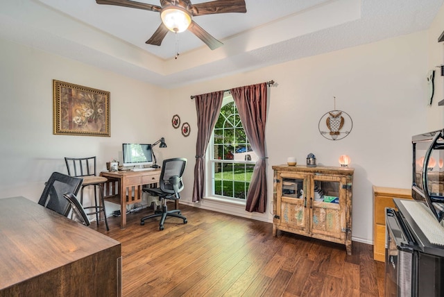 10253 Fieldcrest Dr, Benbrook, TX 76126 - home office with a raised ceiling, dark wood finished floors, a ceiling fan, and baseboards