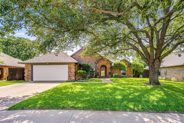 10253 Fieldcrest Dr, Benbrook, TX 76126 - traditional-style house with brick siding, an attached garage, and concrete driveway
