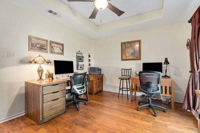 10253 Fieldcrest Dr, Benbrook, TX 76126 - office space featuring ceiling fan, a tray ceiling, and wood finished floors