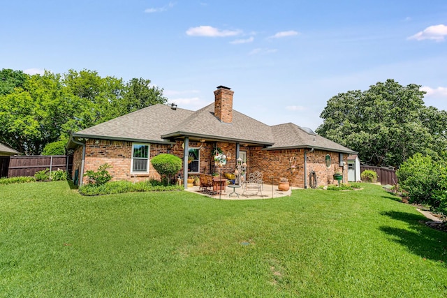 10253 Fieldcrest Dr, Benbrook, TX 76126 - back of house featuring roof with shingles, a chimney, a patio, and brick siding