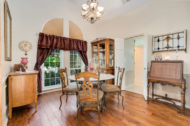10253 Fieldcrest Dr, Benbrook, TX 76126 - dining space with a chandelier, hardwood / wood-style flooring, and vaulted ceiling