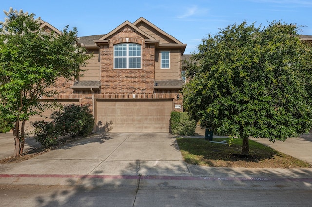 1928 Argyle Ln, Lewisville, TX 75067 - traditional home featuring brick siding, concrete driveway, a garage, and roof with shingles