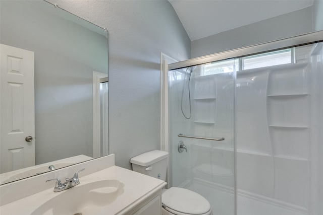 501 Tealwood Dr, Murphy, TX 75094 - bathroom featuring a shower stall, lofted ceiling, toilet, and vanity