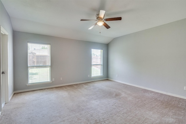 501 Tealwood Dr, Murphy, TX 75094 - carpeted empty room featuring plenty of natural light, vaulted ceiling, ceiling fan, and baseboards