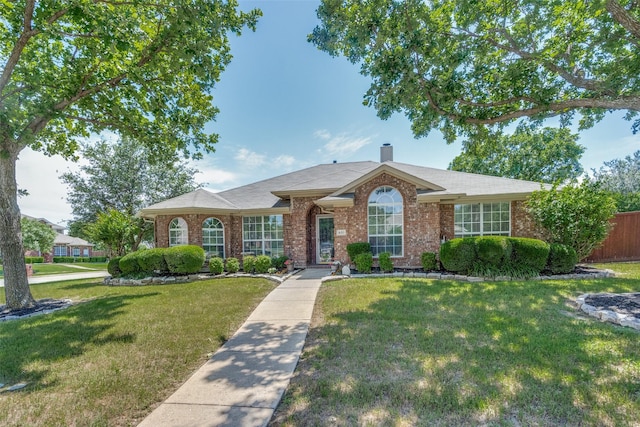 501 Tealwood Dr, Murphy, TX 75094 - view of front facade featuring brick siding and a chimney