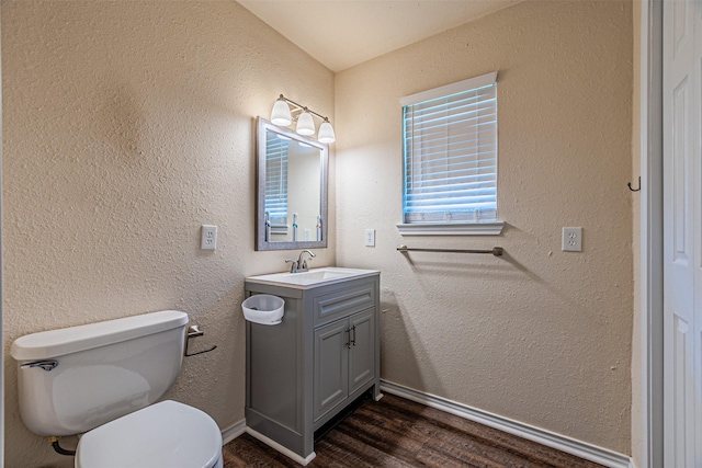 400 Rs County Road 3130, Emory, TX 75440 - bathroom with wood finished floors, toilet, vanity, and baseboards