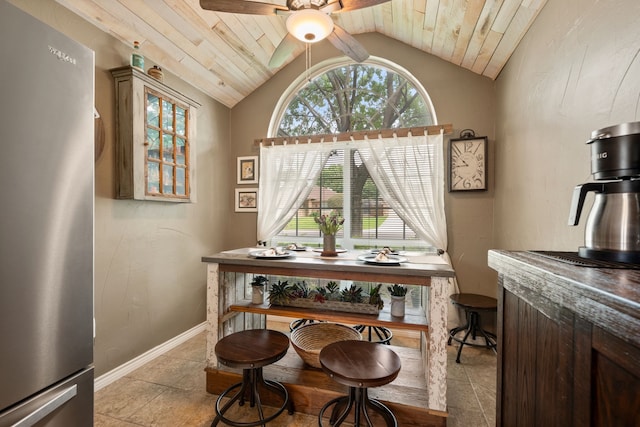 7600 Teresa Ct, North Richland Hills, TX 76182 - dining space featuring ceiling fan, lofted ceiling, wood ceiling, baseboards, and light tile patterned floors
