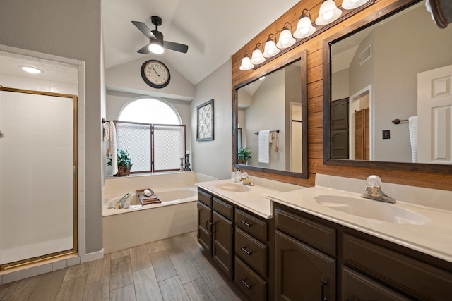 7600 Teresa Ct, North Richland Hills, TX 76182 - full bath with vaulted ceiling, a garden tub, double vanity, a stall shower, and a ceiling fan