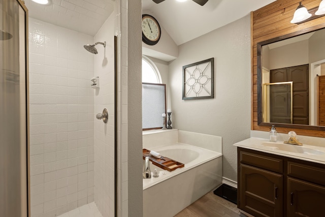7600 Teresa Ct, North Richland Hills, TX 76182 - full bath featuring a shower stall, a bath, vanity, wood finished floors, and vaulted ceiling