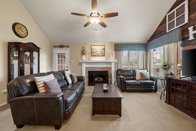 7600 Teresa Ct, North Richland Hills, TX 76182 - living room with vaulted ceiling, light colored carpet, ceiling fan, and a tiled fireplace