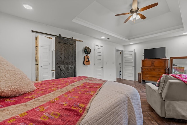511 Mcfarland Ranch Rd, Aledo, TX 76008 - bedroom with a barn door, a tray ceiling, recessed lighting, and ceiling fan