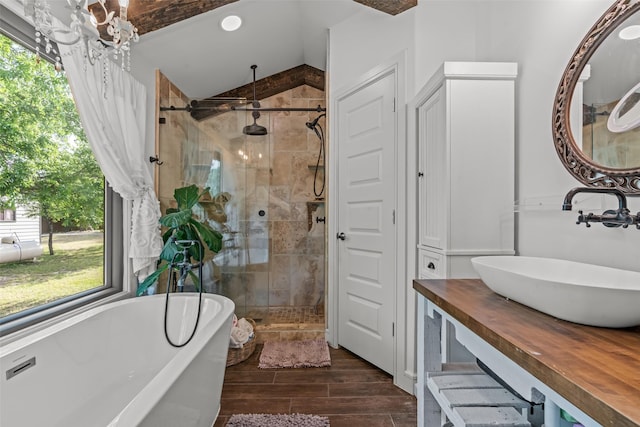 511 Mcfarland Ranch Rd, Aledo, TX 76008 - bathroom with a stall shower, wood finished floors, a freestanding bath, lofted ceiling, and vanity