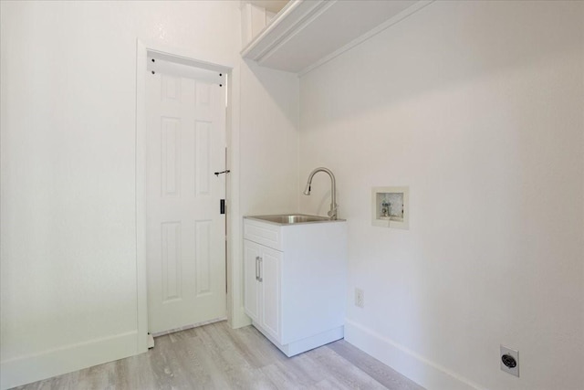 4291 County Road 862, Mckinney, TX 75071 - laundry area with hookup for an electric dryer, washer hookup, light wood-style flooring, baseboards, and cabinet space