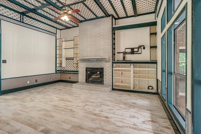 4291 County Road 862, Mckinney, TX 75071 - home theater room with wood finished floors, ceiling fan, a brick fireplace, and baseboards