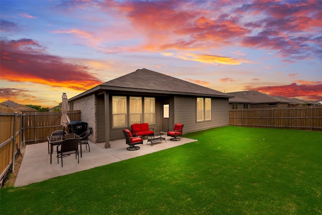 9700 Serviceberry Ln, Fort Worth, TX 76036 - back of house at dusk featuring a patio and an outdoor living space