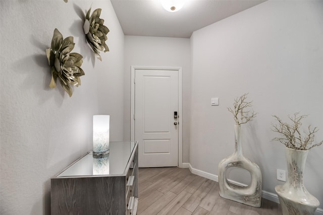 9700 Serviceberry Ln, Fort Worth, TX 76036 - entryway with baseboards and light wood finished floors