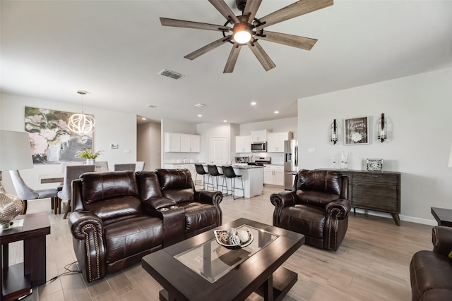 9700 Serviceberry Ln, Fort Worth, TX 76036 - living room featuring a ceiling fan, light wood finished floors, recessed lighting, and baseboards