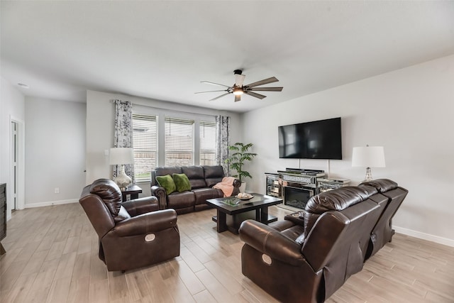 9700 Serviceberry Ln, Fort Worth, TX 76036 - living room featuring ceiling fan, baseboards, and light wood-type flooring